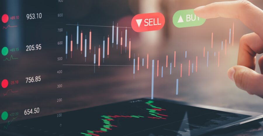 Stock exchange market concept, hand touching on trading icon screen with graphs analysis candle line on bokeh colors light.